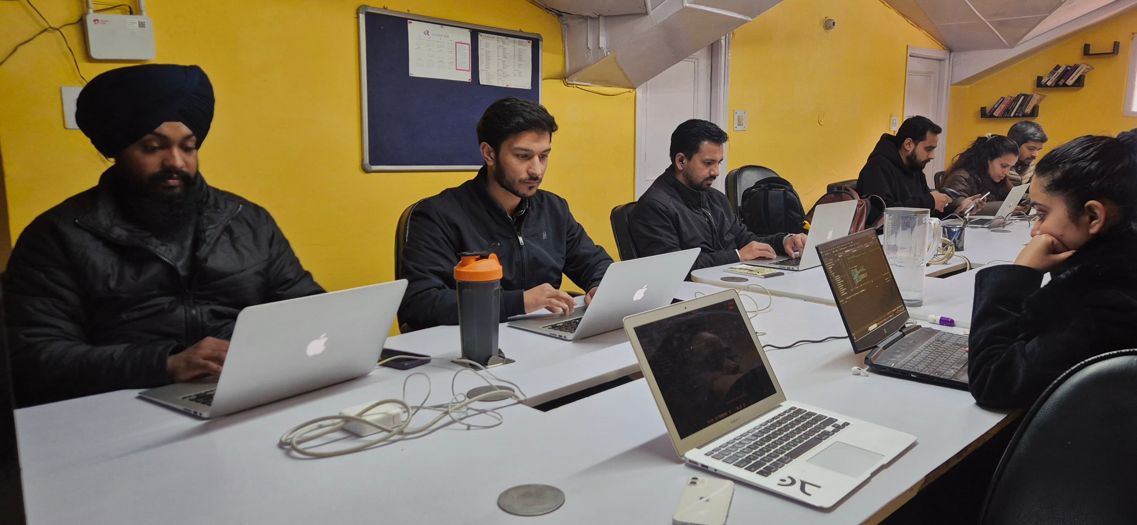 Summerhill engineers building systems at their desks in Shimla